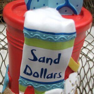 Sand Dollar Bank Made of Stone Resin Measures 6 1/2" tall by 4" wide 049-15102